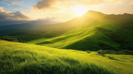 Obraz premium a picturesque piece of land featuring a lush green mountain with rolling grass, bathed in soft sunlight, inviting relaxation and the beauty of the natural world in a tranquil setting