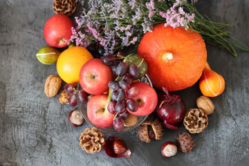 Still life photo with apples and grapes. Close up of seasonal vegetables and fruit. Balanced diet and healthy lifestyle concept. 