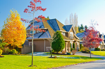 luxury house with garage door, big tree and nice Fall Foliage landscape in Vancouver, Canada