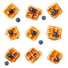 Delicious set of mini waffles, perfectly bite-sized and served with a variety of sweet toppings for a delightful treat.