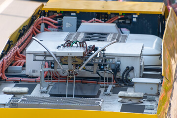 Close-up of electrical components and wiring inside vehicle.