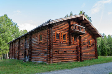 Old big wooden house in North Russia, summer time