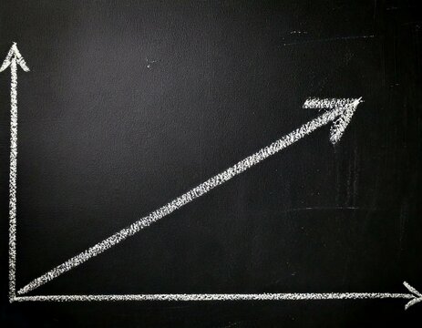 Graph with arrow diagonal up on a graph indicating business financial economic grow growth increase profit success chalk drawing on a Blackboard Chalkboard Illustration Isolated