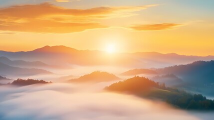 Obraz premium The image shows sun rays shining through clouds above a fog-covered mountain range.