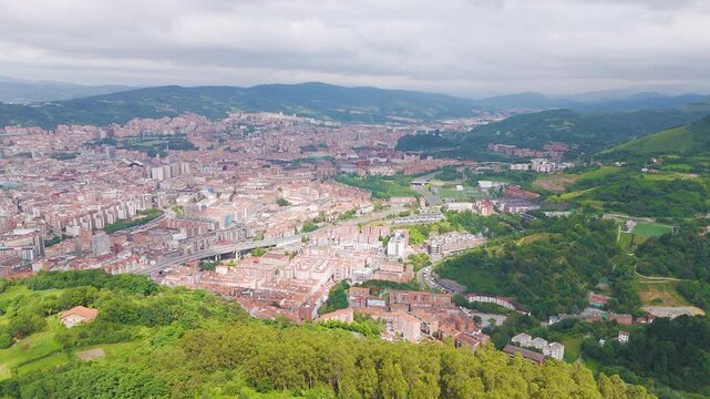 Aerial footage of the cityscape of Bilbao on a sunny day in Basque Country in northern Spain