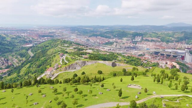 Aerial footage of the green mountains surrounding Bilbao city in Basque Country in northern Spain
