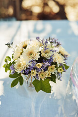 Table, flowers or bouquet at luxury event, celebration or decoration setting outdoor at backyard. Floral plants, party and vase closeup with leaves or eco friendly chrysanthemum for design at venue