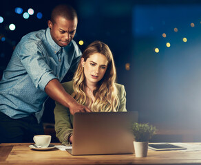 Employees, laptop and news at night in office, journalism mentor and helping with article. Business...