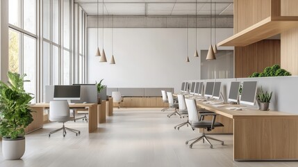 A modern office space with open workstations, natural light, and a collaborative atmosphere