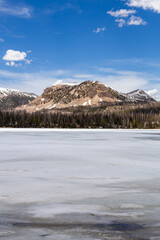 Scenic Mountain View Over Partially Frozen Lake in Utah Wilderness
