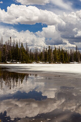 Fototapeta premium Scenic Mountain Lake Reflection With Dramatic Clouds