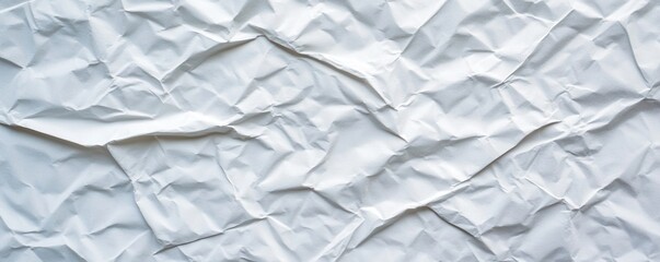 Fototapeta premium Crumpled white paper texture with folds and creases