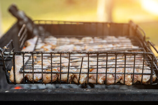 Chiken on the grill - paleo food photography.Delicious chiken steak, hot barbecue grill.Roasted chiken leg Grilled, BBQ