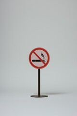 A red and white sign with a cigarette stuck out of it, great for use in advertising or commercial settings