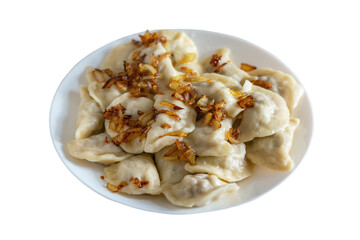 Ukrainian dumplings seasoned with fried onions in a plate isolated on white background
