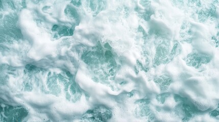Fototapeta premium A powerful image depicting white ocean foam creating dynamic patterns in turbulent waters, offering a dramatic representation of nature's raw energy and force.