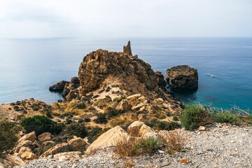 coastal view of rocky cliffs and ocean in Parque Natural del Cabo de Gata Nijar under a clear sky