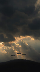 Obraz premium The Three Crosses on Calvary in a Cloudy Sky. Christianity and Jesus Christ simbolism.