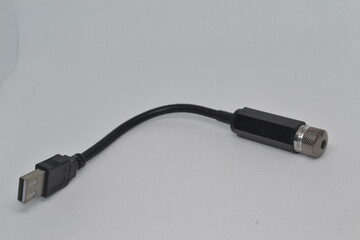 Close-up of a flexible USB-powered lamp with a black body. Ideal for product photography, tech gadgets, and electronics projects showcasing portable lighting solutions