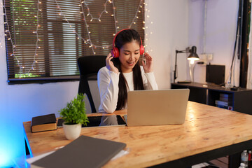 Asian woman listening to music, having fun