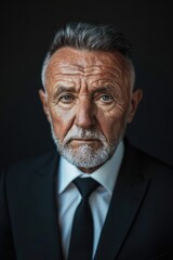 Obraz premium Older gentleman dressed in formal attire