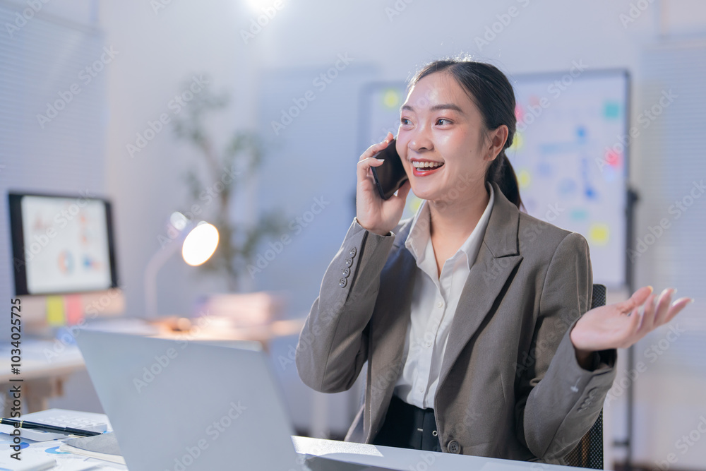 Wall mural cheerful businesswoman multitasks happily in a modern office, analyzing data and strategizing for su