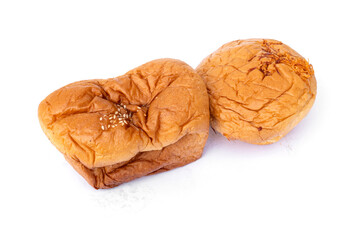 Fluffy Square and round bread with filling inside and sprinkled with white sesame seeds on the top isolated on white background.