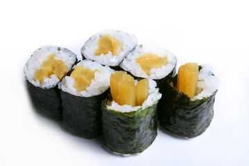 Oshinko Maki. Pickled radish rolled with sushi rice wrapped by dried seaweed on white background 