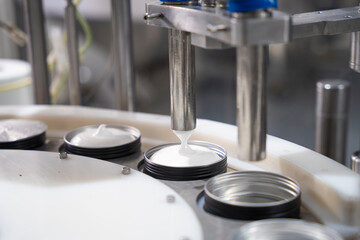 Production line of beauty and healthcare products at plant or factory. Process of manufacturing and...