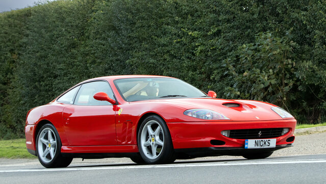 1998 red Ferrari 550 classic car