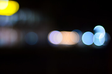 Abstract background of blurred image of night light with bokeh effect from the camera