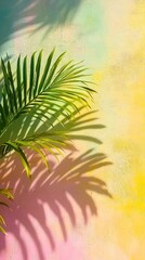 Vibrant tropical palm leaf casts intricate shadow on pastel-colored wall, creating a mesmerizing interplay of light, texture, and natural beauty in a serene setting.