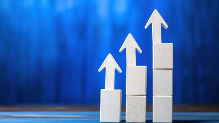 Wooden Arrows Ascending on White Blocks Against Blue Background