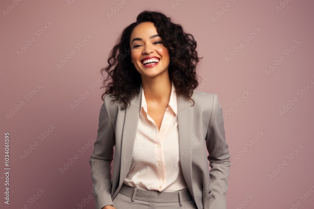 Poster Portrait of a smiling indian woman in her 30s wearing a professional suit jacket in front of pastel or soft colors background