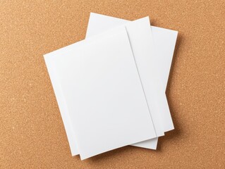 Three blank sheets of paper on a cork background, ideal for design and presentations.