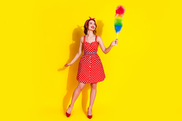Photo of lovely pretty lady wear red stylish dress hold duster clean house look empty space...