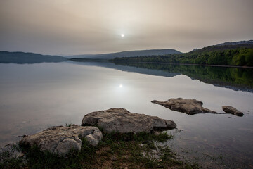 sunrise on a mountain lake, cloudy weather, Shaori Reservoir Georgia