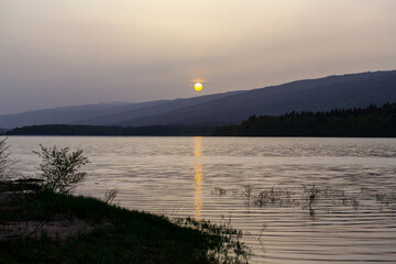 sunrise on a mountain lake, cloudy weather, Shaori Reservoir Georgia