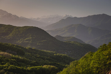 mountain ranges at sunset in the haze