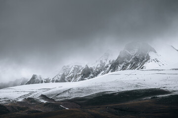 Obraz premium Snow-capped mountains with clouds, Caucasus mountains,