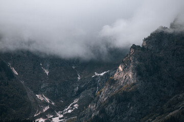 Mountains in the clouds, waterfall in the harsh mountains of Georgia