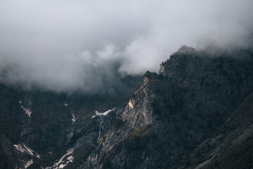 Mountains in the clouds, waterfall in the harsh mountains of Georgia