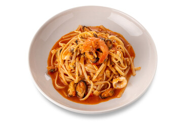 Linguini spaghetti pasta with seafood and tomato sauce in white plate cut out