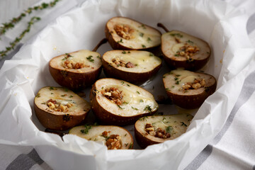 Homemade Blue Cheese Stuffed Pears with Honey, Thyme and Walnuts, side view.