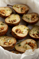 Homemade Blue Cheese Stuffed Pears with Honey, Thyme and Walnuts, side view.