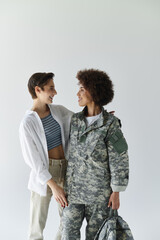 A young couple shares a heartfelt moment as one prepares for military service, showcasing love and support.