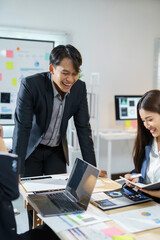 Team of asian businesspeople are having a productive meeting, laughing and sharing ideas