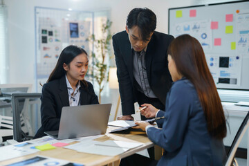 Team of asian businesspeople is having a productive meeting in the conference room