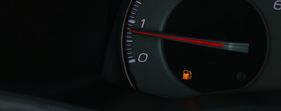 Empty fuel warning light in car dashboard. Fuel pump icon. gasoline gauge dash board in car with digital warning sign of run out of fuel turn on. Low level of fuel show on speedometer dashboard.