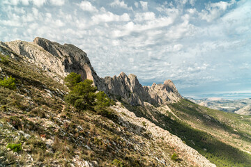 Panoramic view of a rocky mountain with some peaks, in Bernia, Alicante (Spain)
